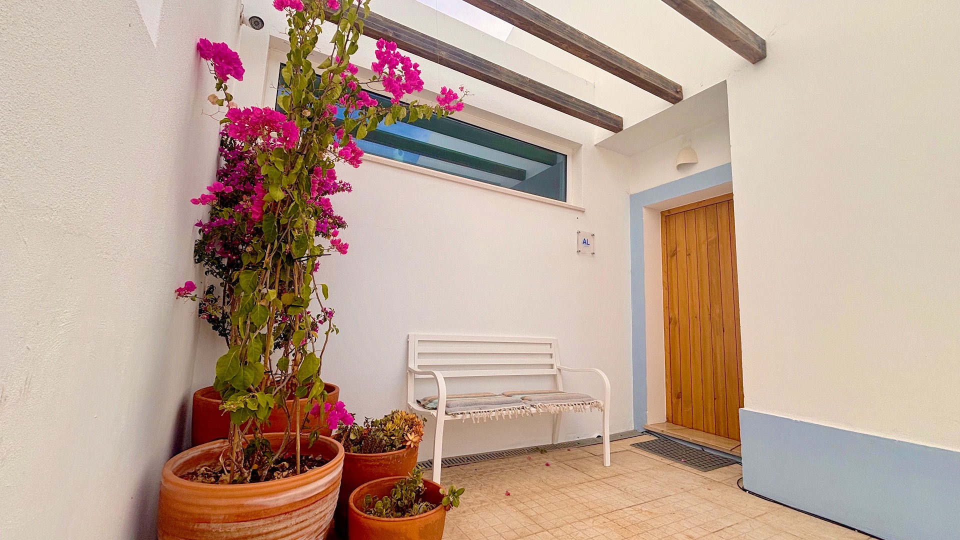 Patio entry with potted bougainvillea